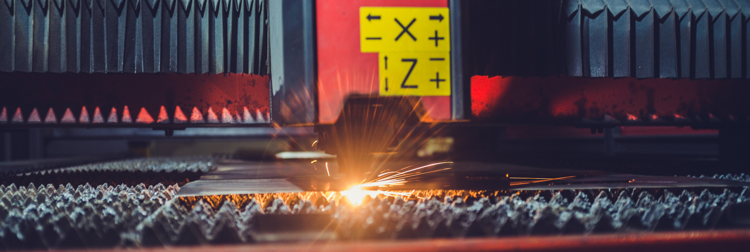 Laser cutting sheet metal on a cutting bed