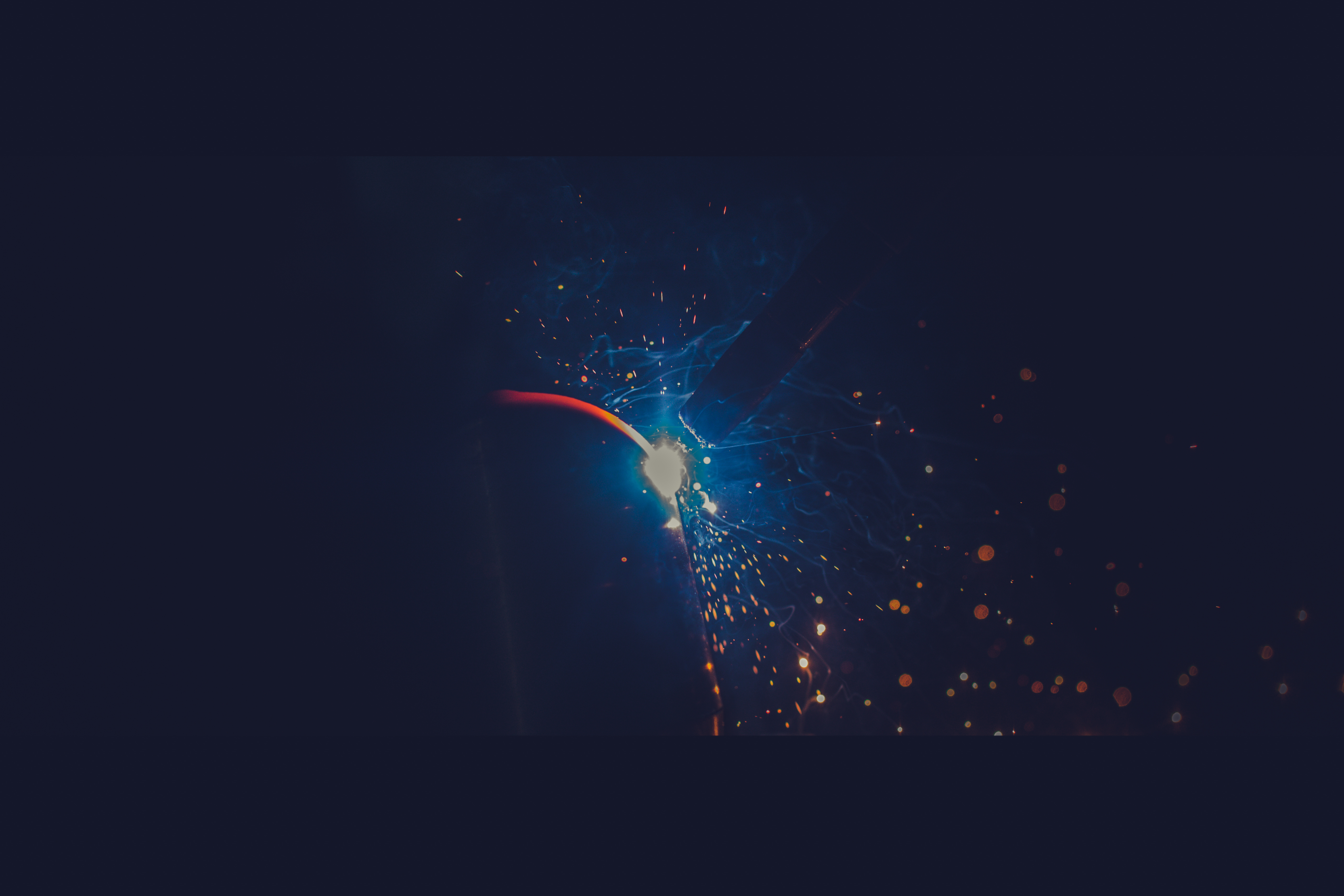 Close-up of the welding arc and sparks at a metal joint